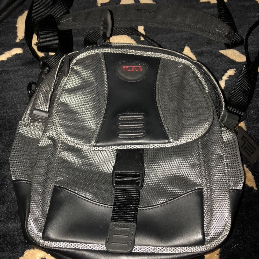 Tumi small  crossbody mesh style bag